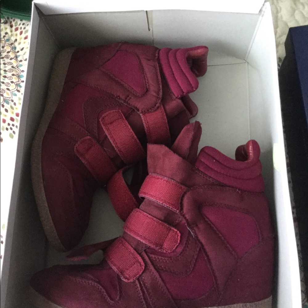Pair of burgundy suede high top sneakers